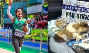 女子跑马拉松，遇到一只全身颤抖的小狗，她抱起小狗跑完30公里